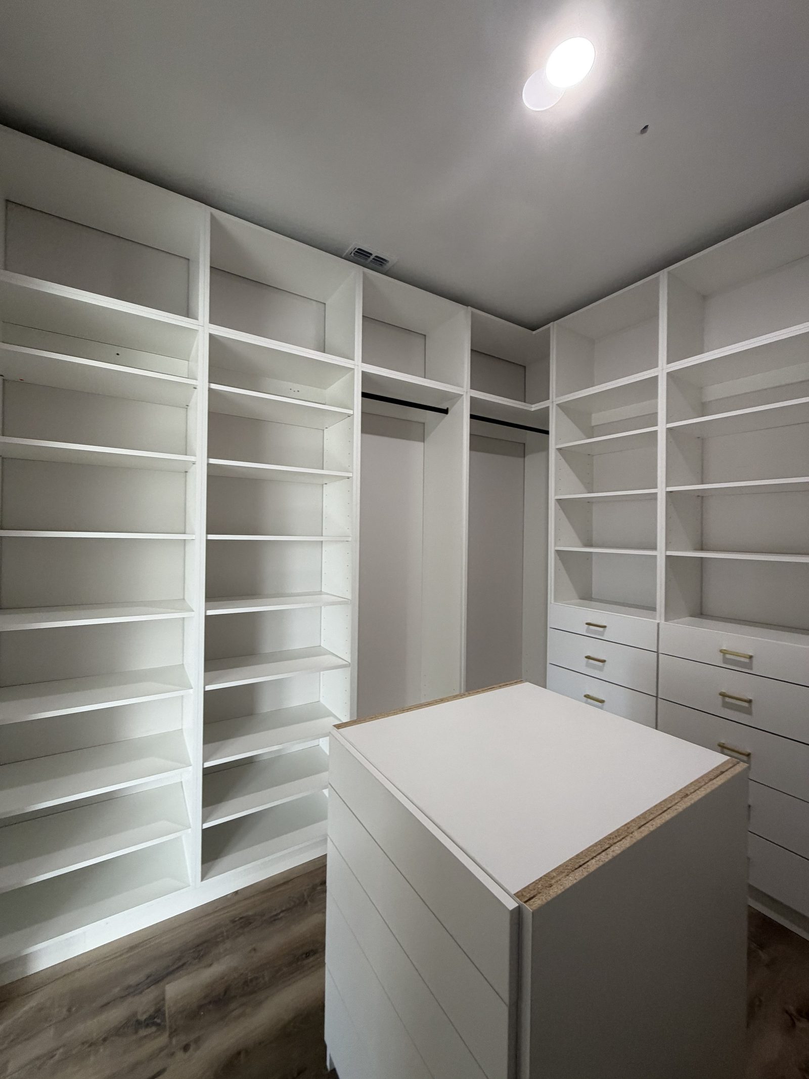 Walk-in closet drawers and shelving