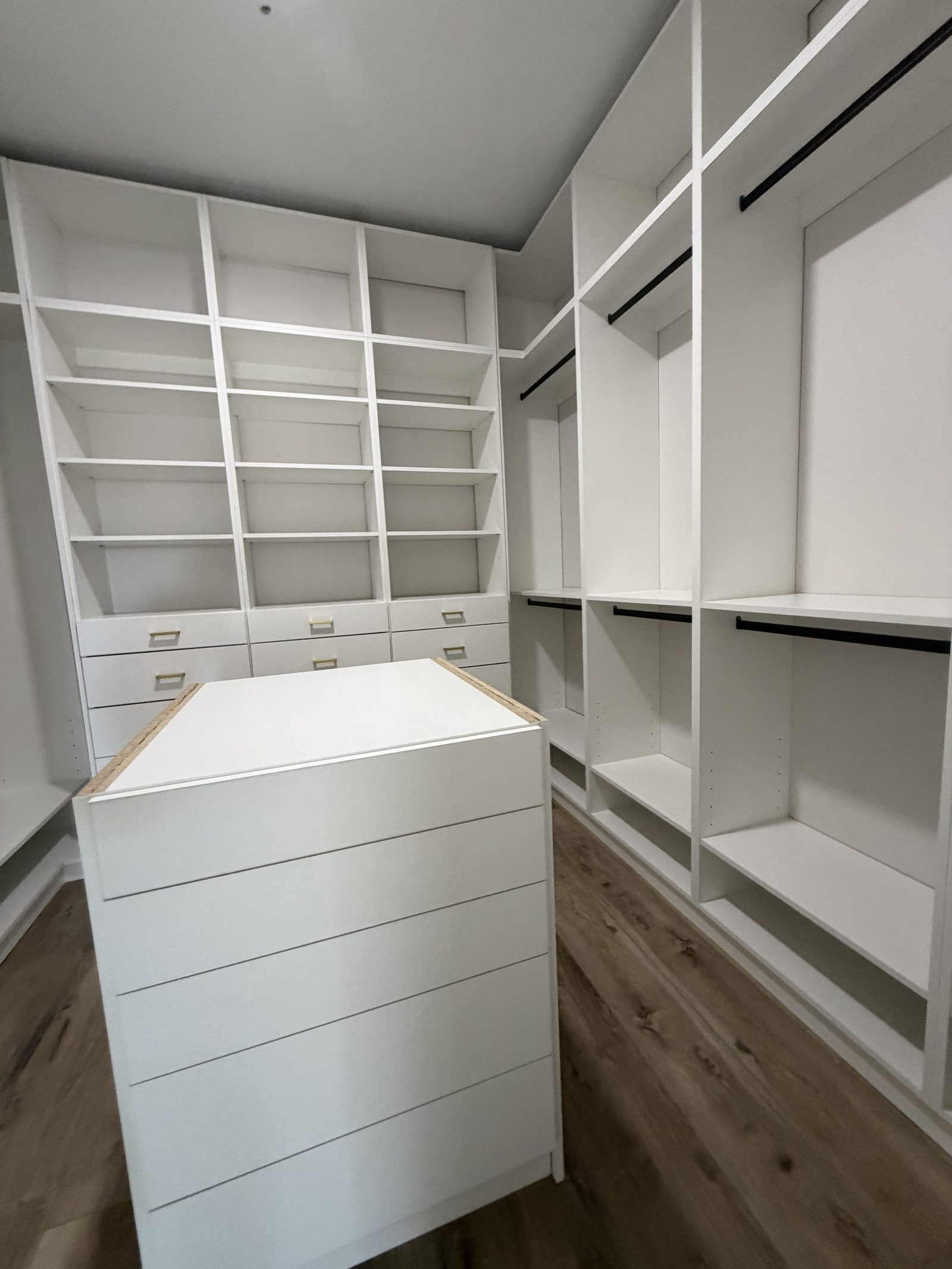 L-shaped walk-in closet full view