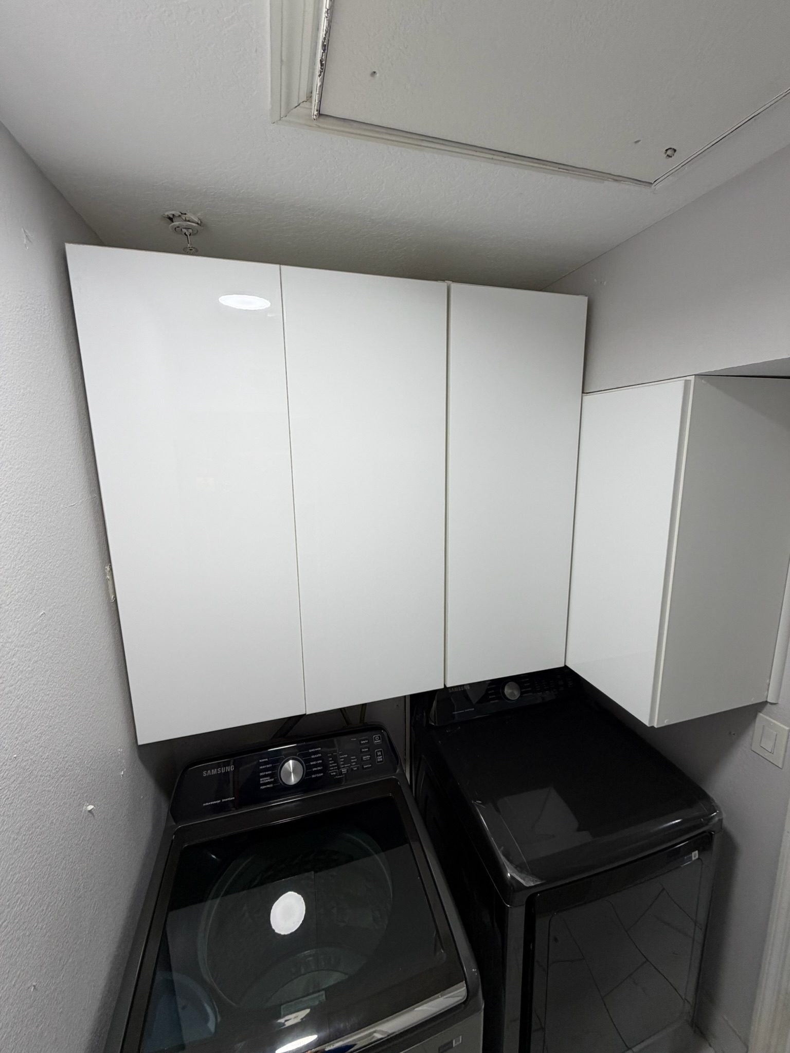 Symmetrical built-in wardrobe in showroom light