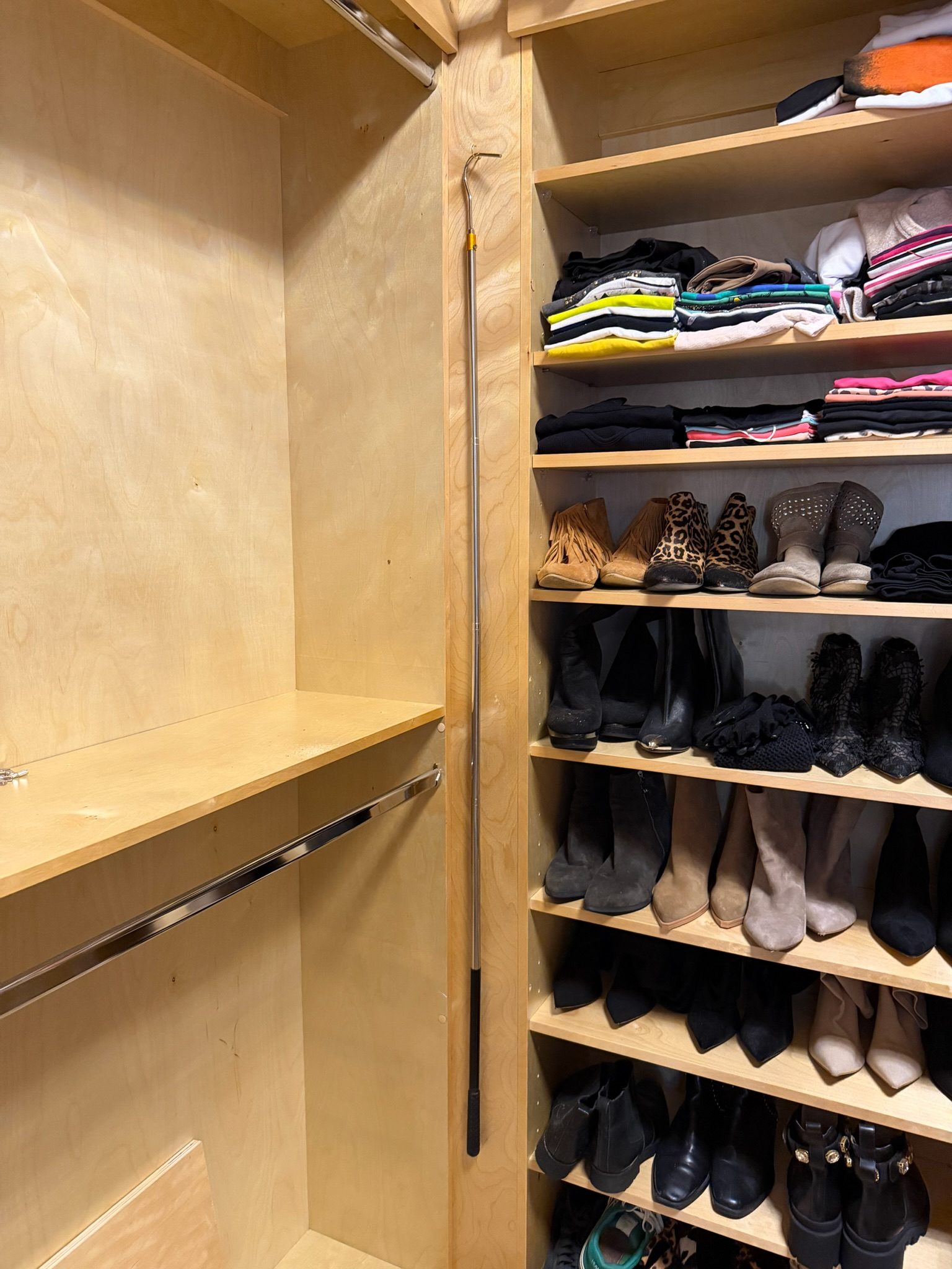 Walk-in with rolling ladder and shoe storage